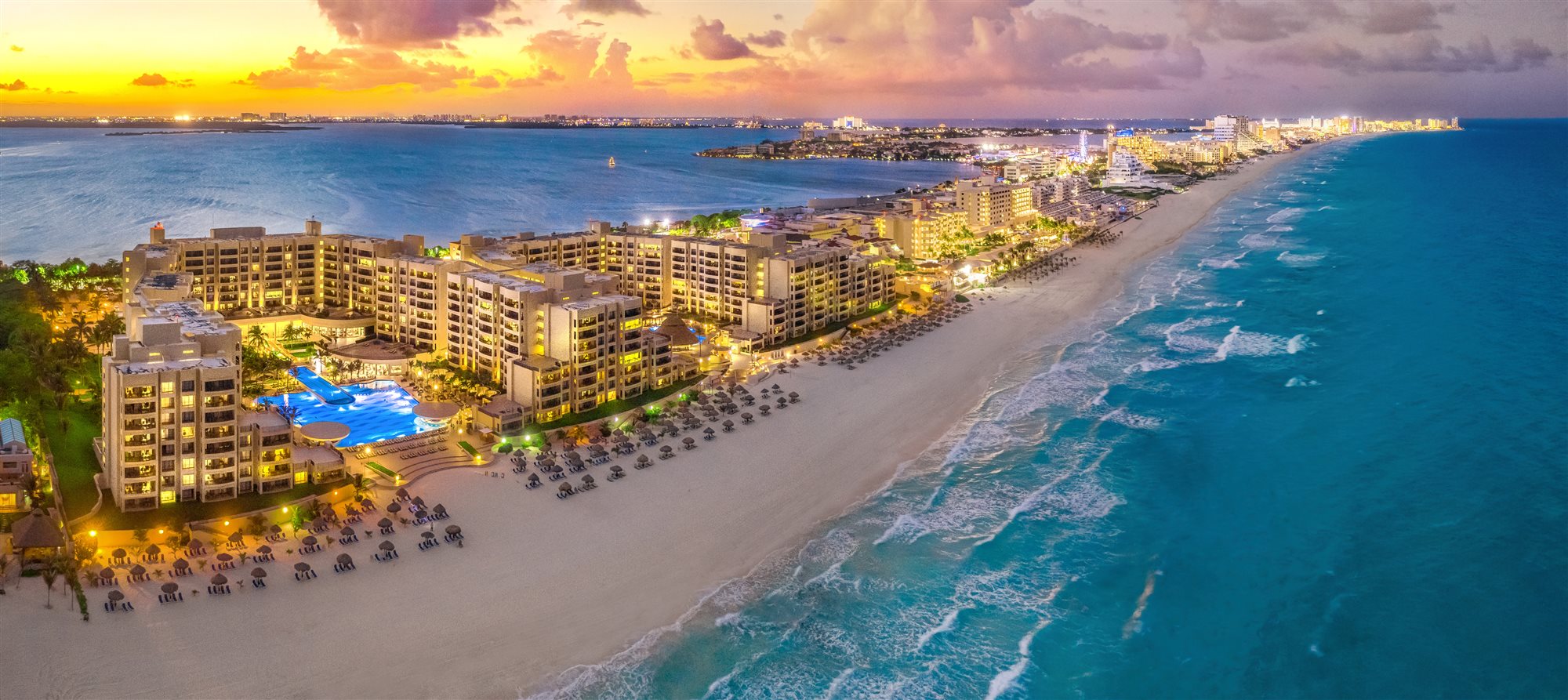 Luxury beachfront resort at sunset